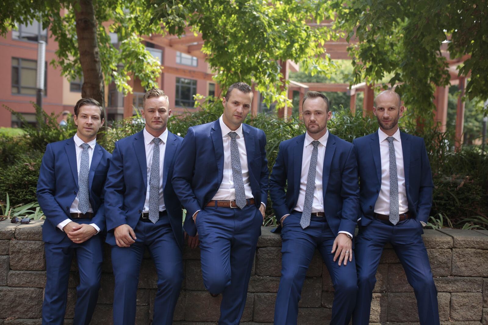 Greg and his groomsmen gathered outdoors