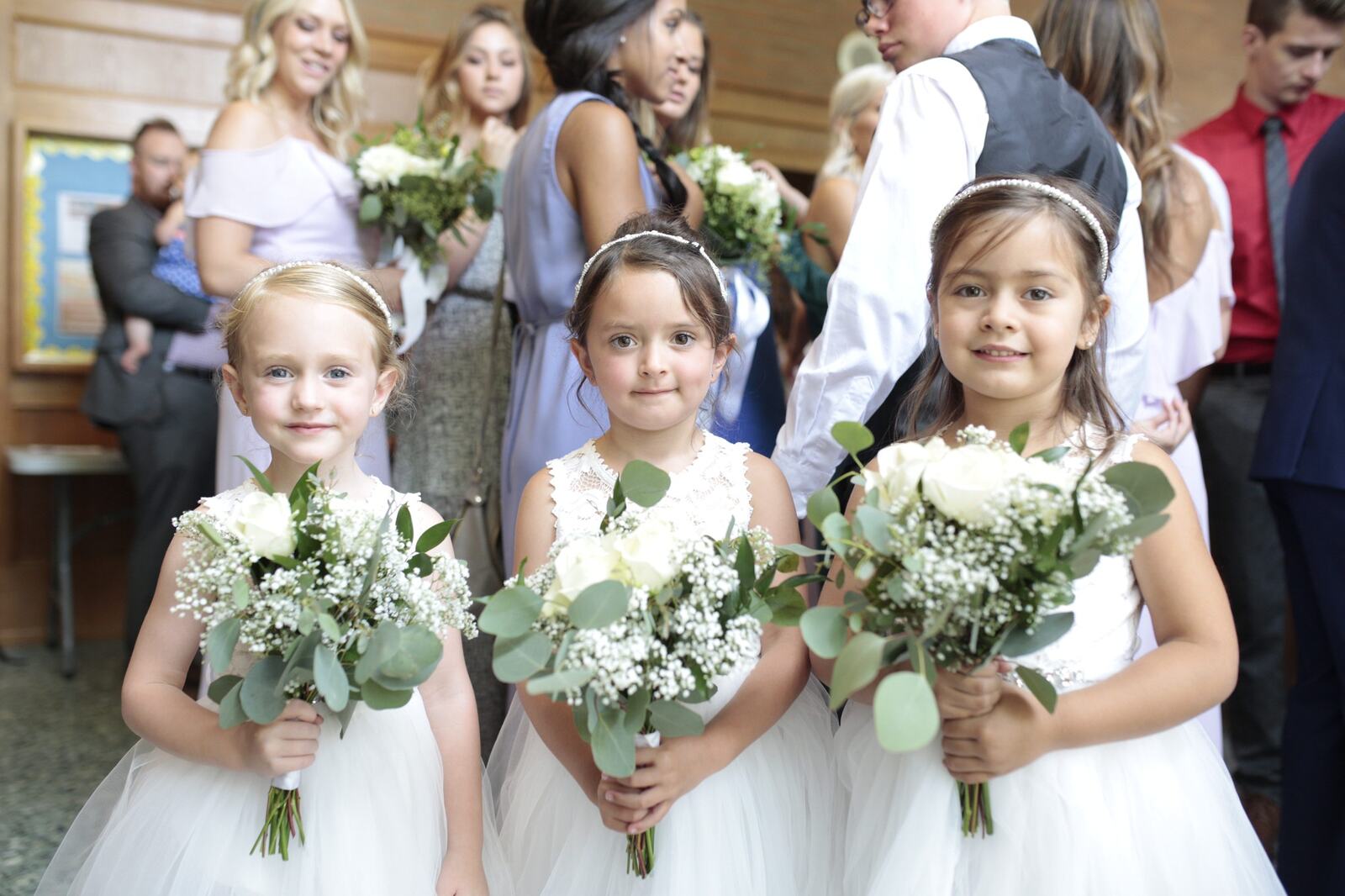 Flower girls walking together during the ceremony