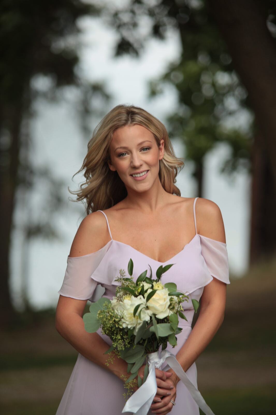 Second bridesmaid portrait in soft lakeside light