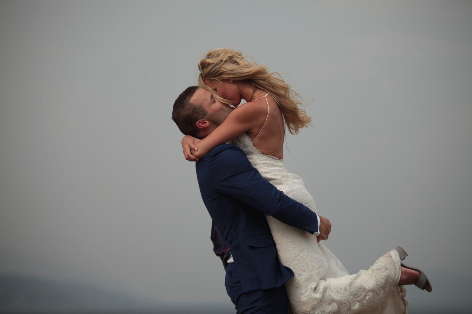 Close portrait of Sarah and Greg celebrating together