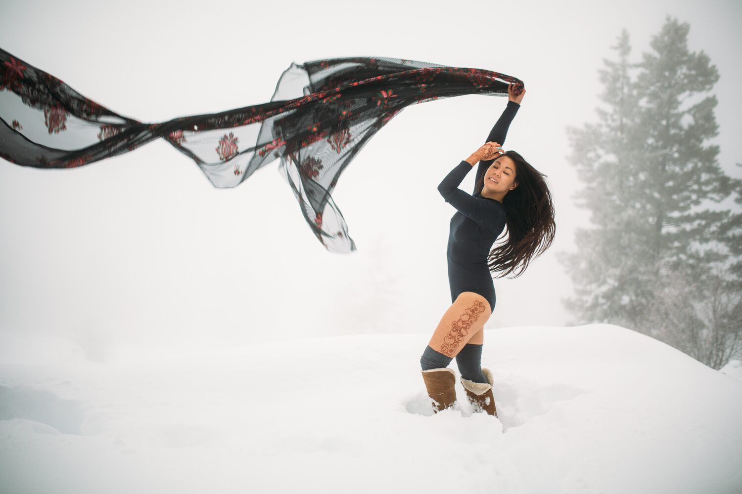 Sarah: Henna, Snow and Candlelight portraits story frame 11: A four-part portrait story with Sarah in Kelowna, moving from a living-room henna session into snow, a daylight coconut-milk bath and a candlelit bath.