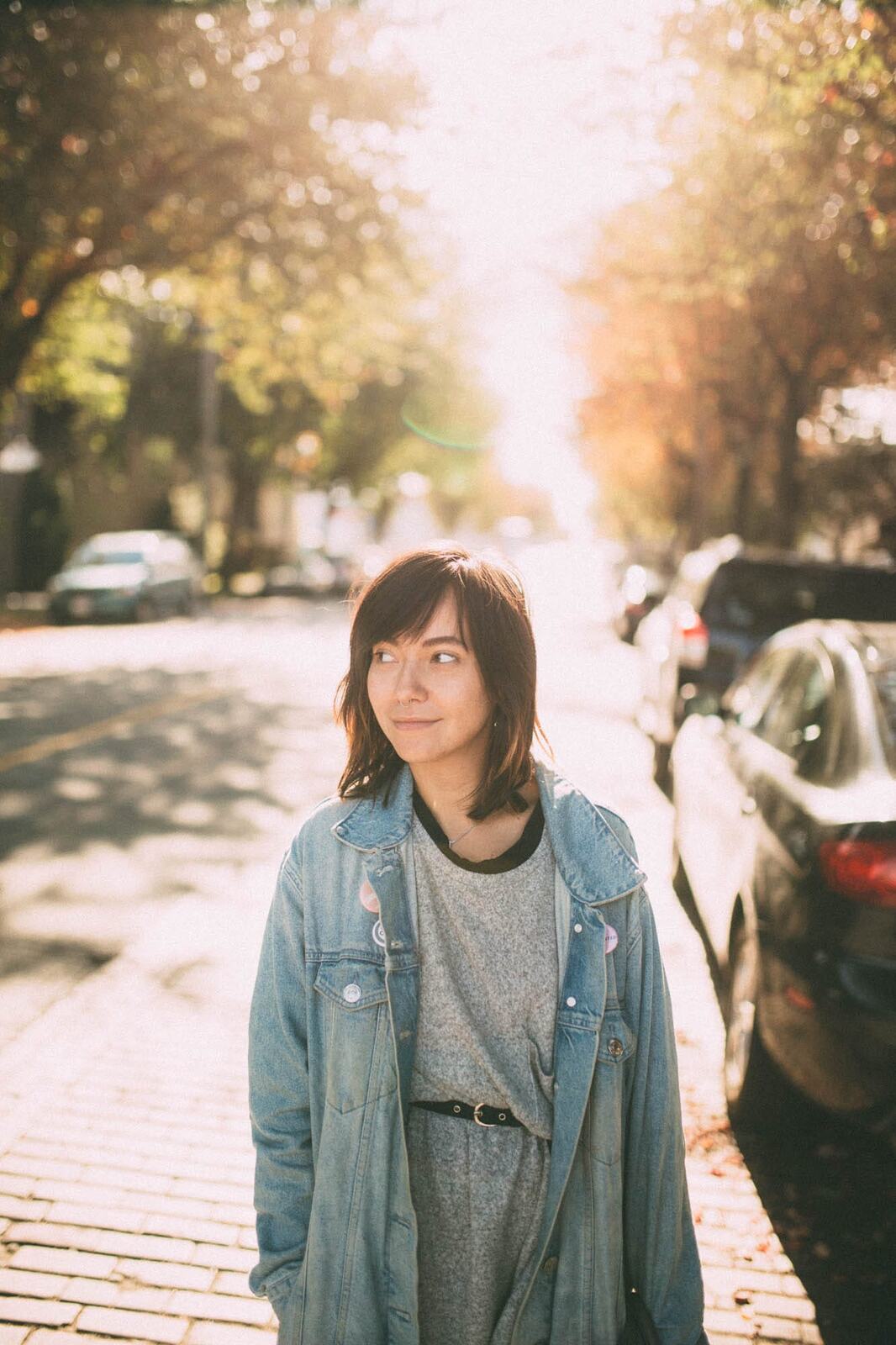 Savannah in Vancouver portraits story frame 14: Vancouver portraits for Savannah with pale walls, green city paths, soft street light and a gentle late-afternoon portrait rhythm.