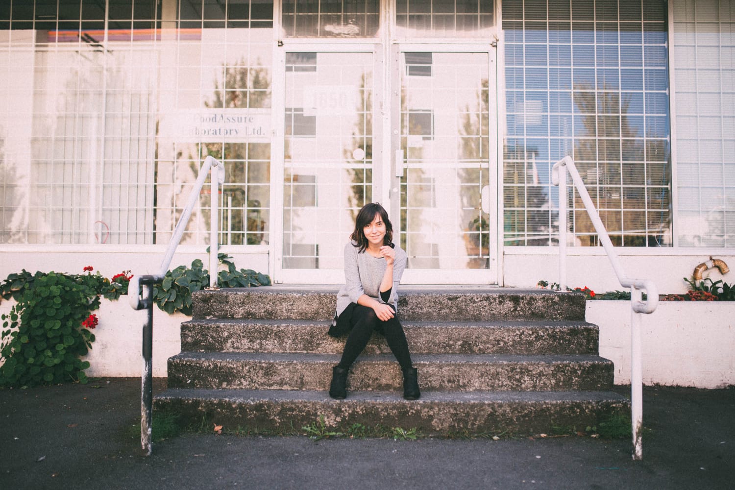 Savannah in Vancouver portraits story frame 16: Vancouver portraits for Savannah with pale walls, green city paths, soft street light and a gentle late-afternoon portrait rhythm.