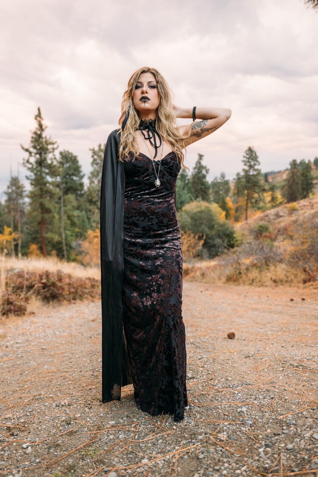 Sophia Halloween portraits story frame 6: A darker seasonal portrait story with candles, rain, rocks, and a little ritual atmosphere.