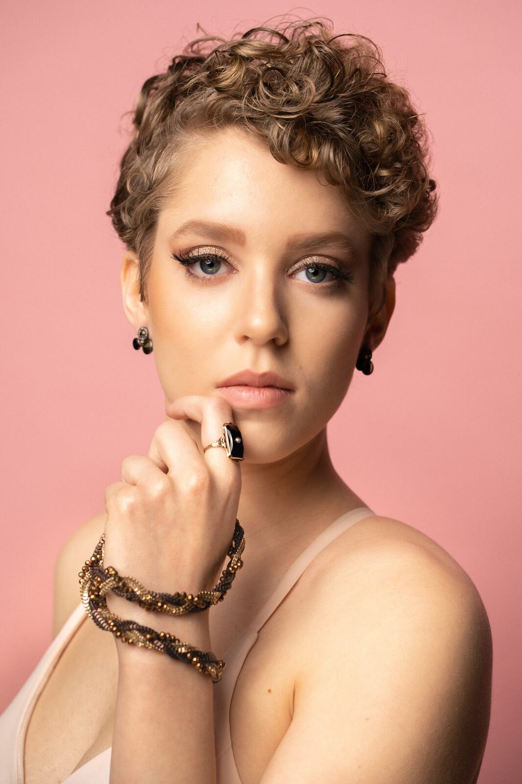 The Barbershoppe / Diva Den Bridal Formals corporate story frame 17: Collaborative bridal-formal brand photography for The Barbershoppe and Diva Den Day Spa, with hair, makeup, formal looks, studio portraits and campaign-ready beauty imagery..