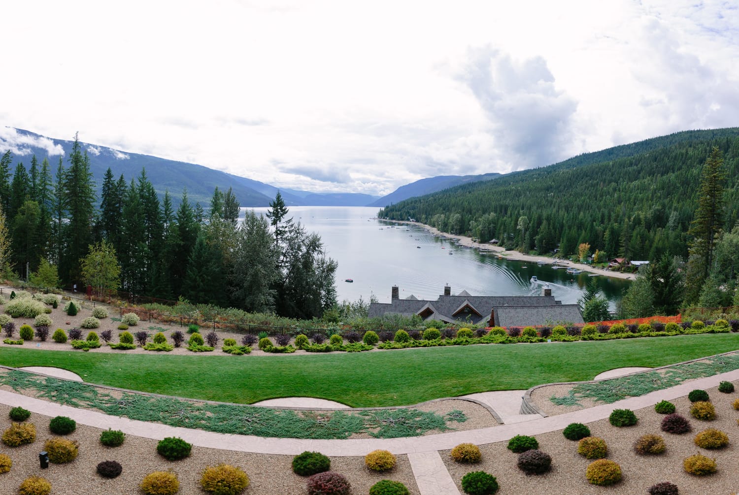 Tia and Matt weddings story frame 2: A Mabel Lake Airpark wedding in the North Okanagan, with grass-runway scenery, mountain openness and a warm end-of-night invitation..